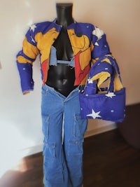 a mannequin wearing a jacket and jeans